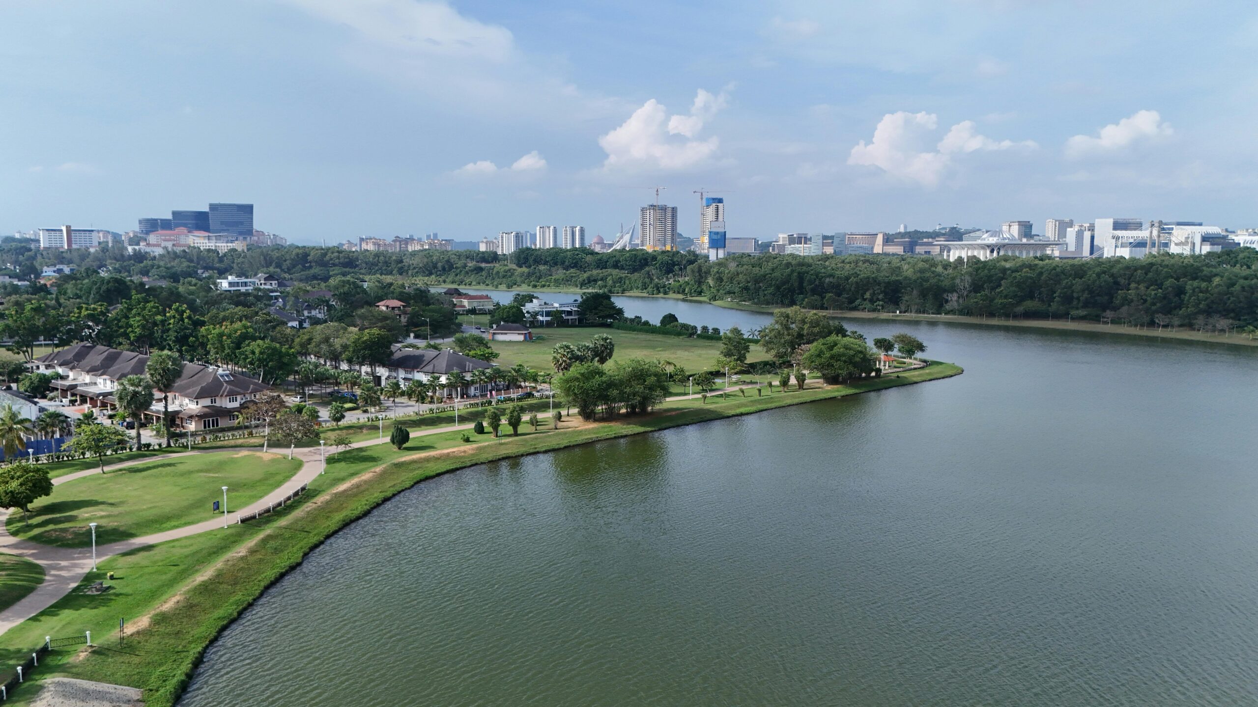 A stunning aerial view of Cyberjaya in Selangor, Malaysia, showcasing parks, a river, and modern architecture.